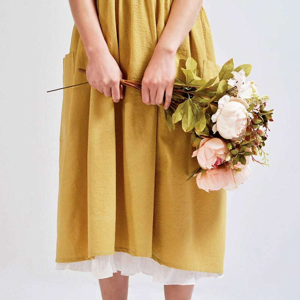 Tablier à bretelles croisées avec poches