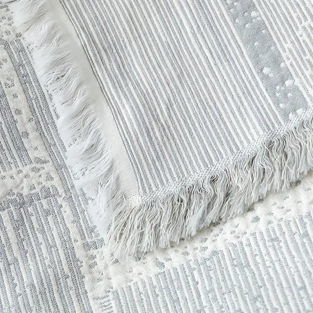 Plaid en coton géométrique tons mêlés