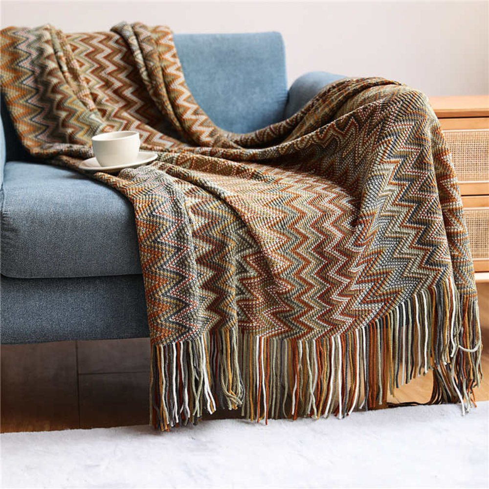 Plaid tricoté à pompons zigzag multicolore