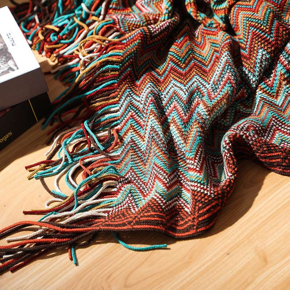 Plaid tricoté à pompons zigzag multicolore