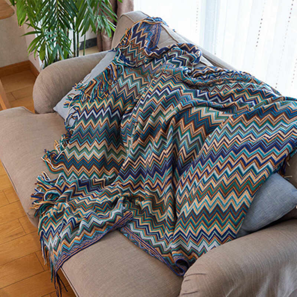 Plaid tricoté à pompons zigzag multicolore