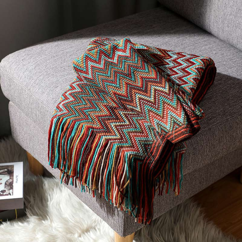 Plaid tricoté à pompons zigzag multicolore