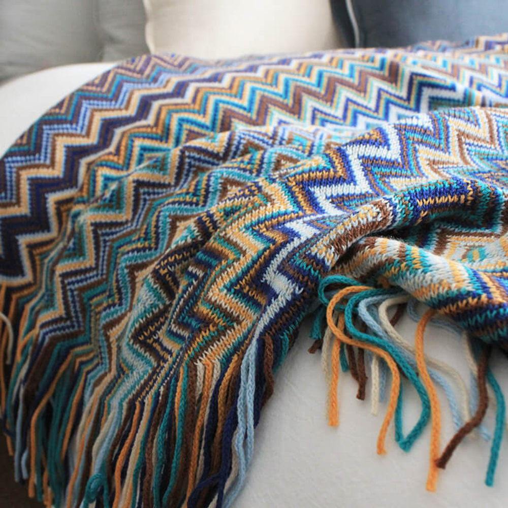 Plaid tricoté à pompons zigzag multicolore