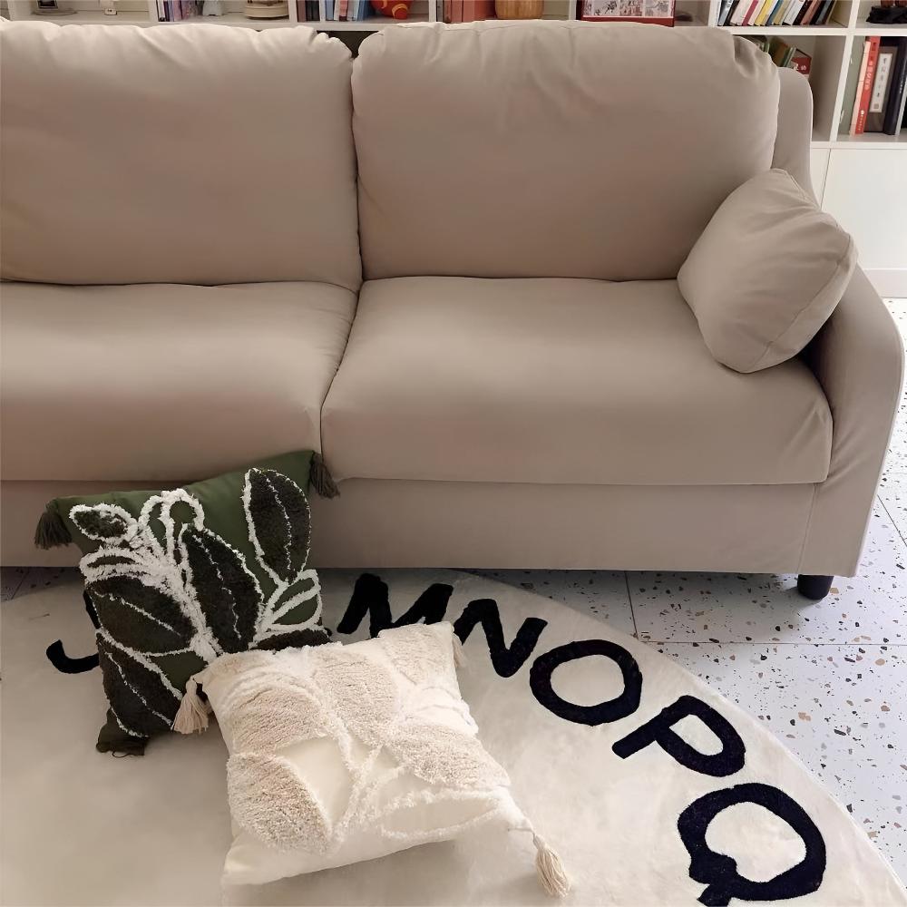Housse de coussin feuille moelleuse à pompons