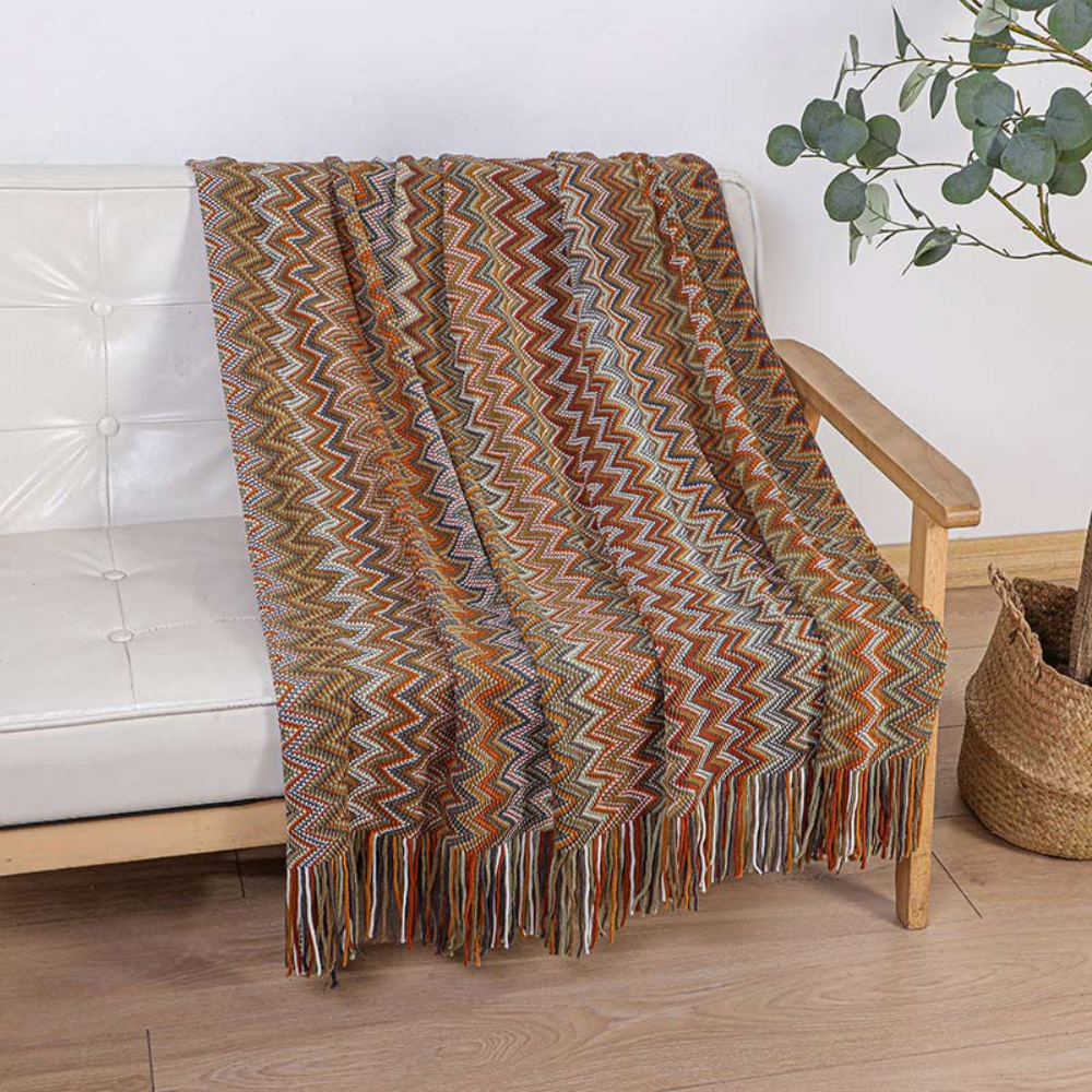 Plaid tricoté à pompons zigzag multicolore