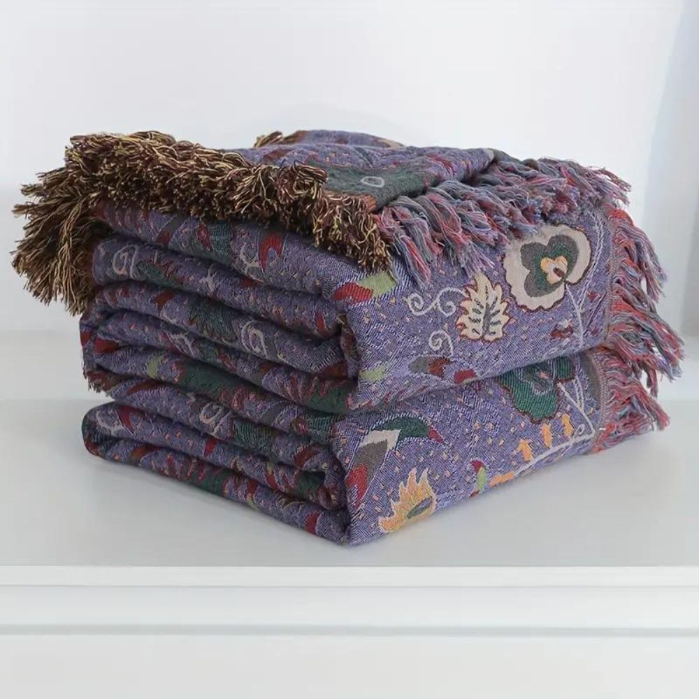 Plaid en coton à pompons motif paon