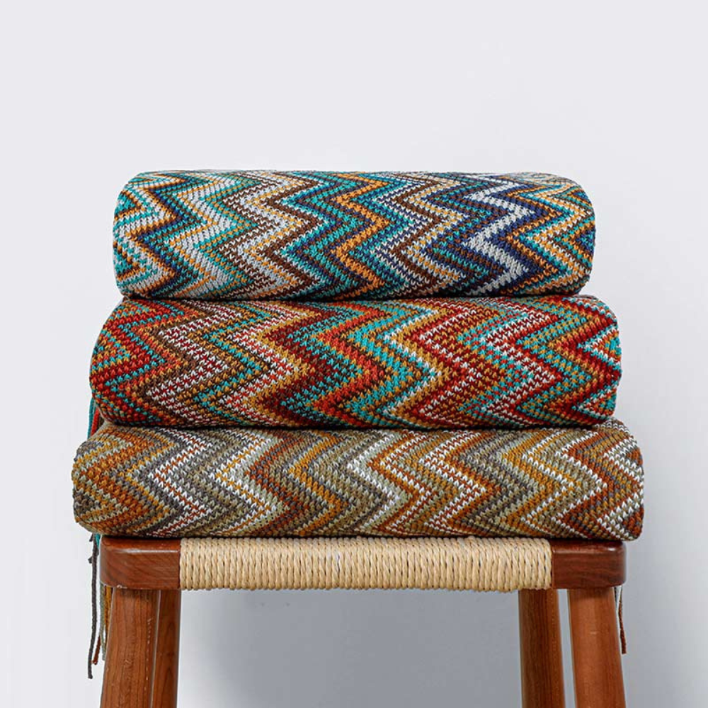 Plaid tricoté à pompons zigzag multicolore