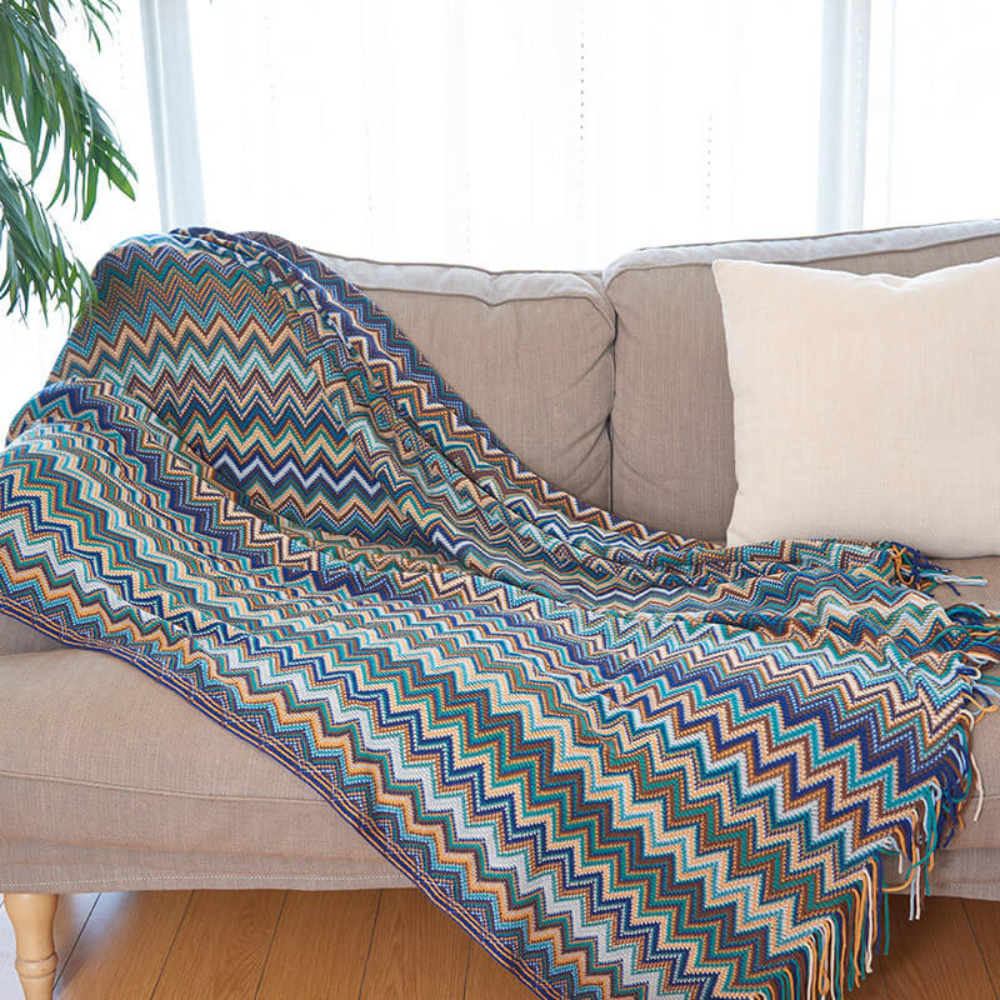 Plaid tricoté à pompons zigzag multicolore