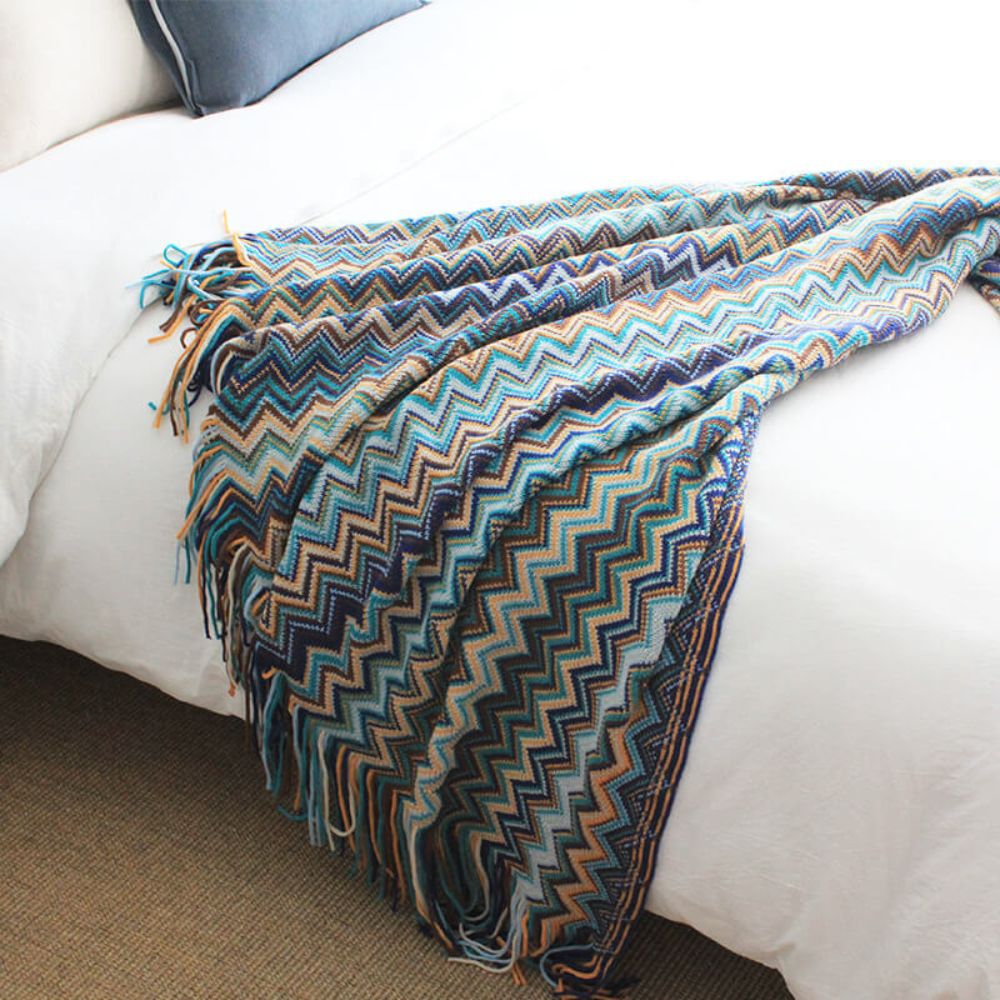 Plaid tricoté à pompons zigzag multicolore