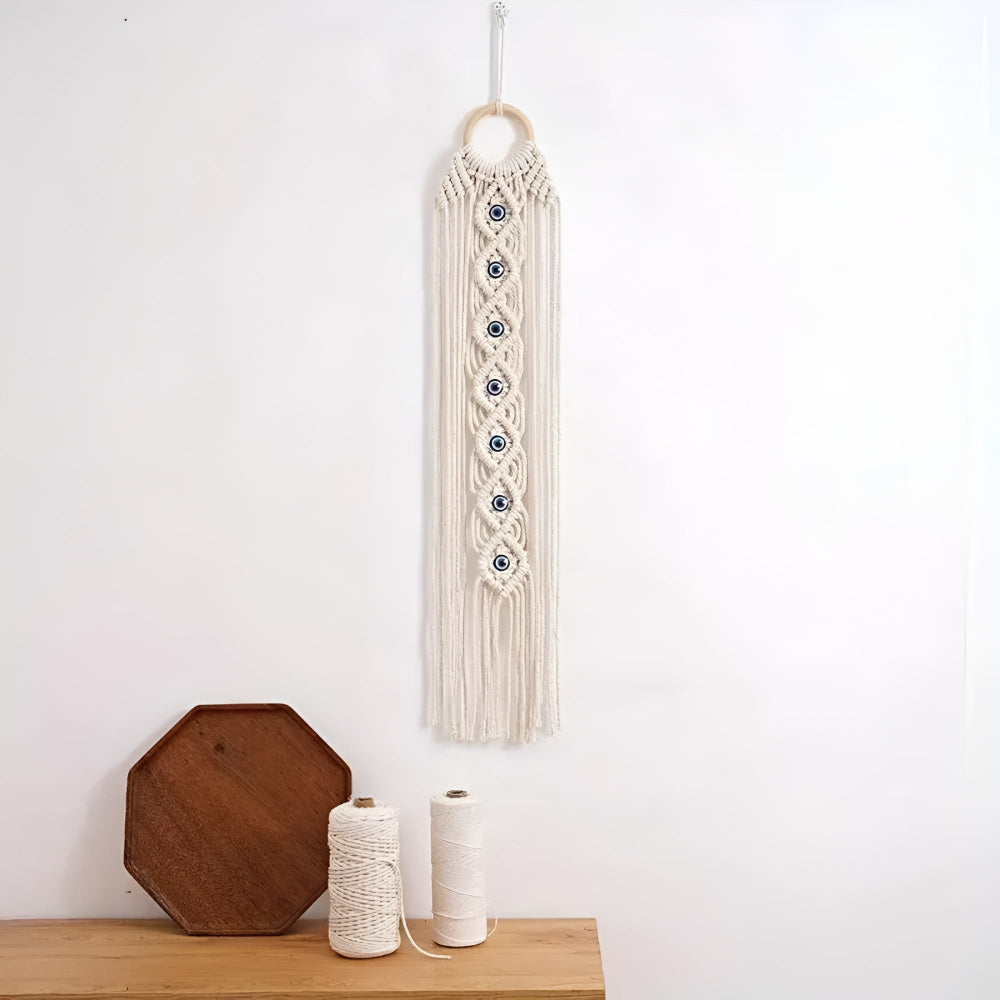 Décoration murale en macramé perles œil bohème