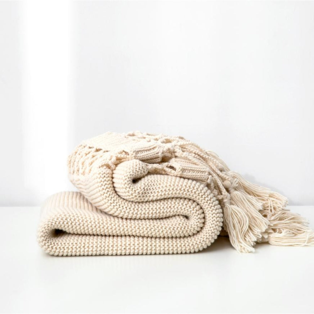 Plaid tricoté tissé à pompons