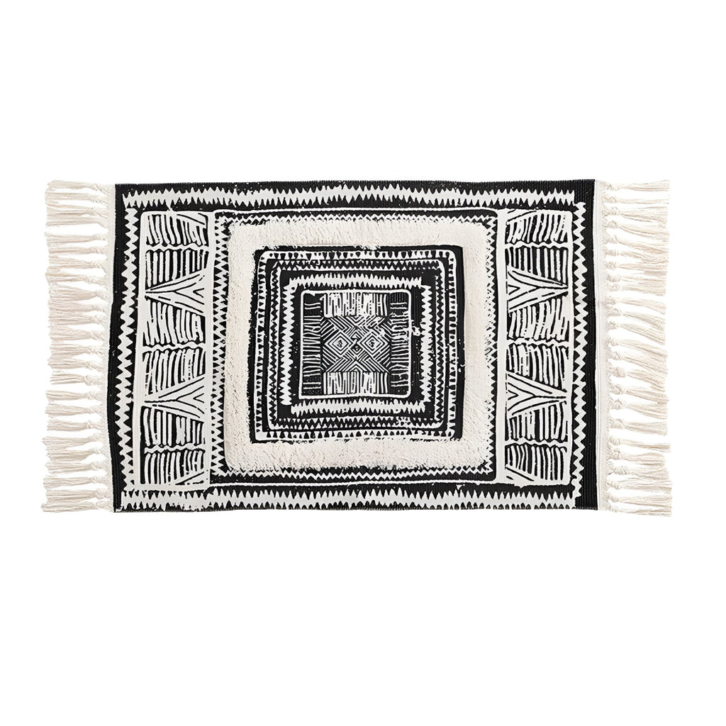 Tapis de sol géométrique noir et blanc à pompons
