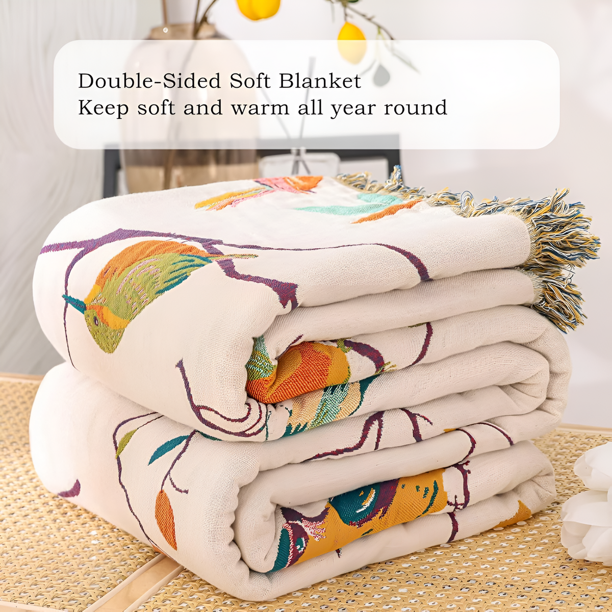 Plaid en coton à pompons motif oiseaux