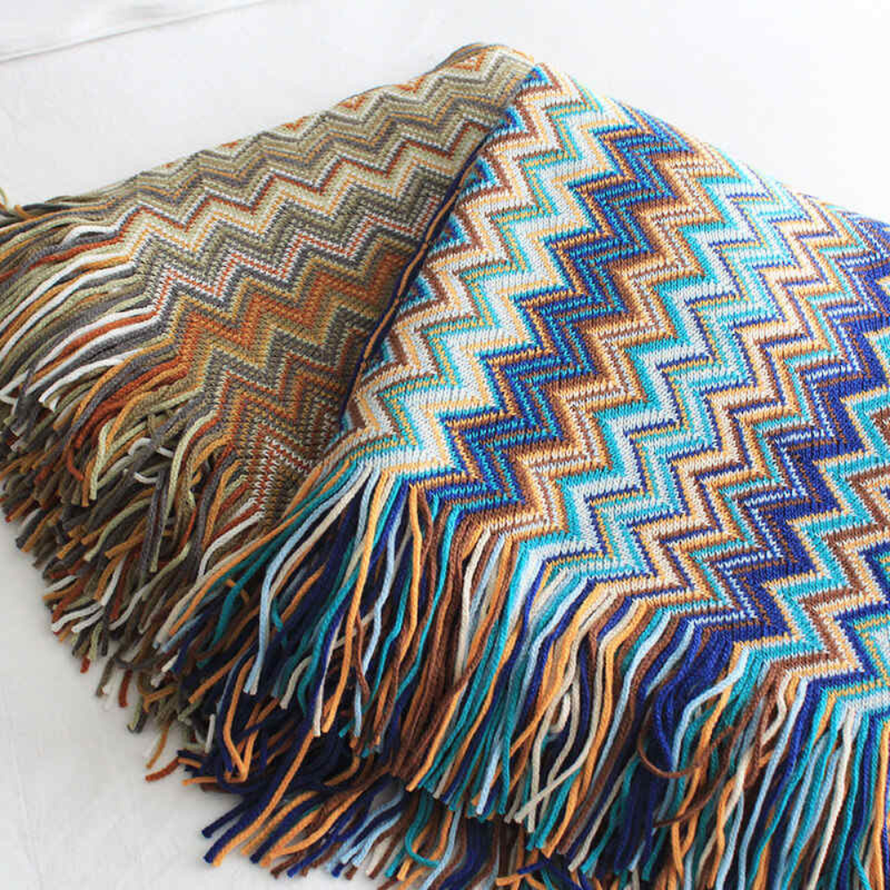 Plaid tricoté à pompons zigzag multicolore
