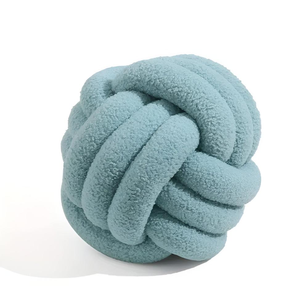 Coussin bouclette noué