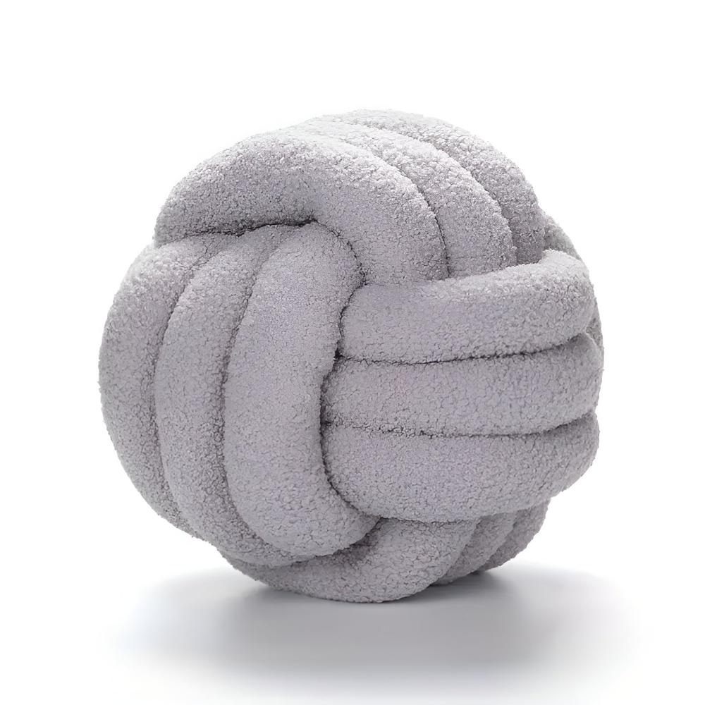 Coussin bouclette noué