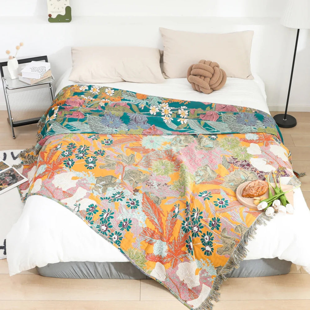Plaid en coton patchwork fleuri bohème à pompons