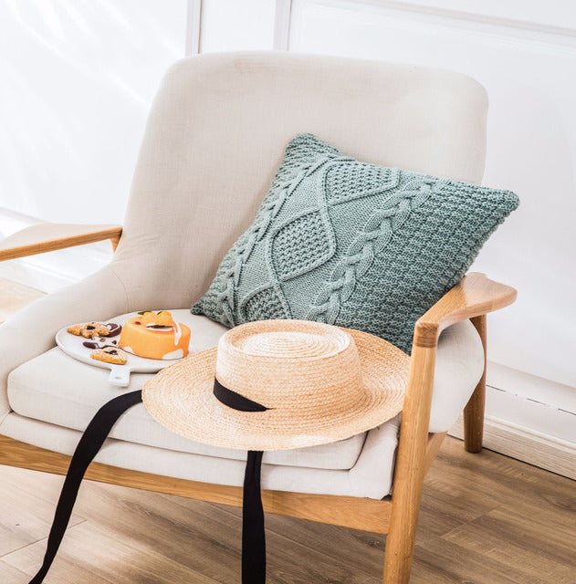 Housse de coussin tricotée tressée