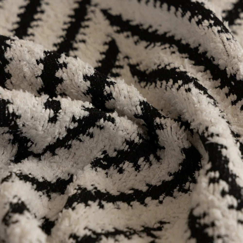 Housse de canapé à chevrons et pompons