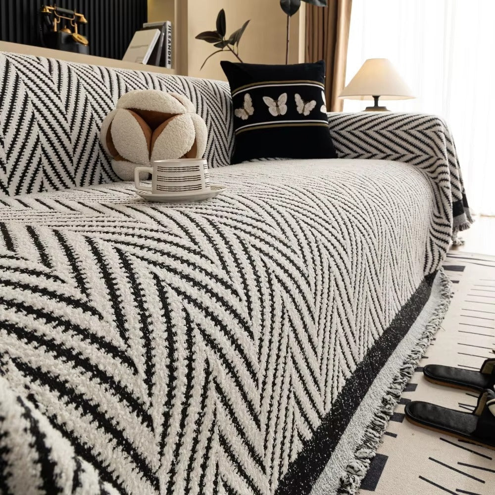 Housse de canapé à chevrons et pompons