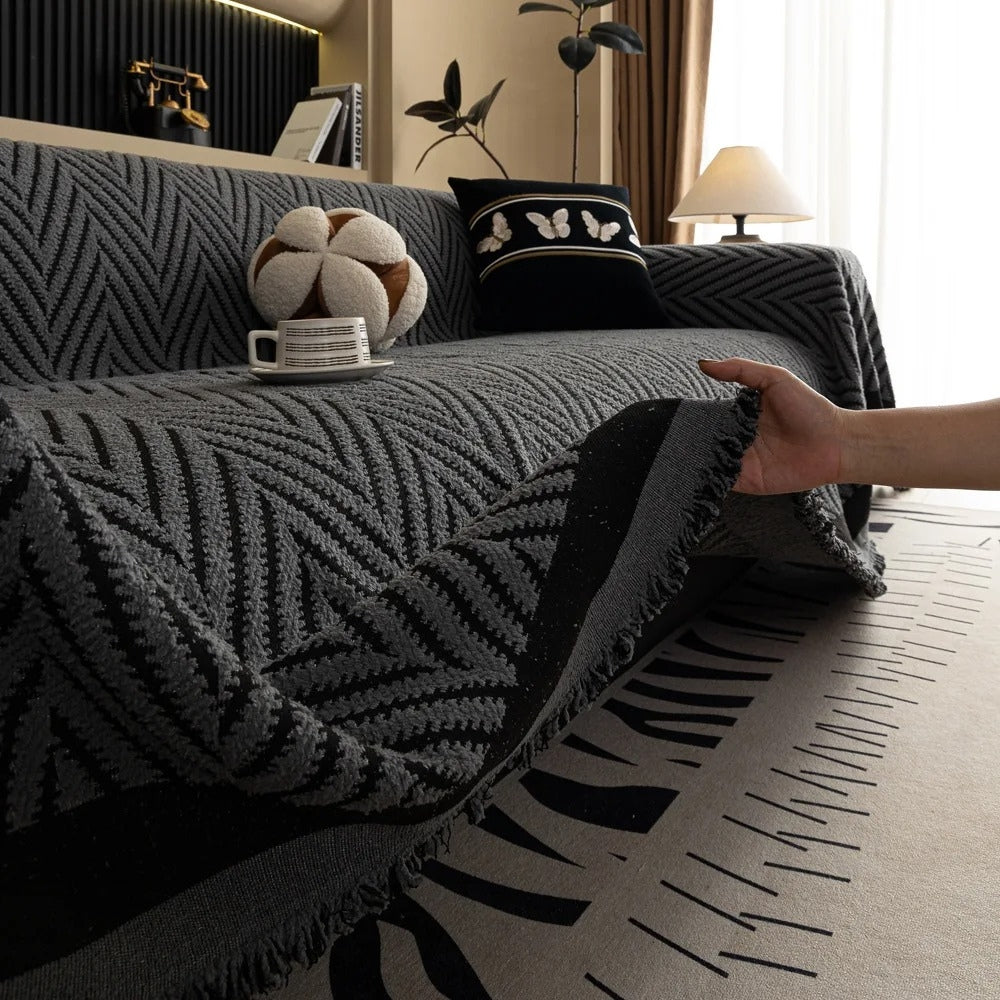 Housse de canapé à chevrons et pompons