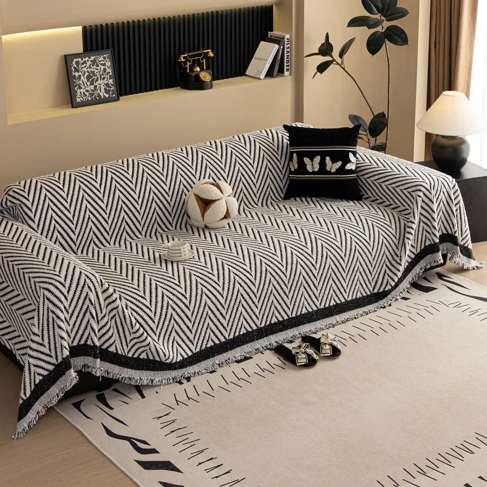 Housse de canapé à chevrons et pompons