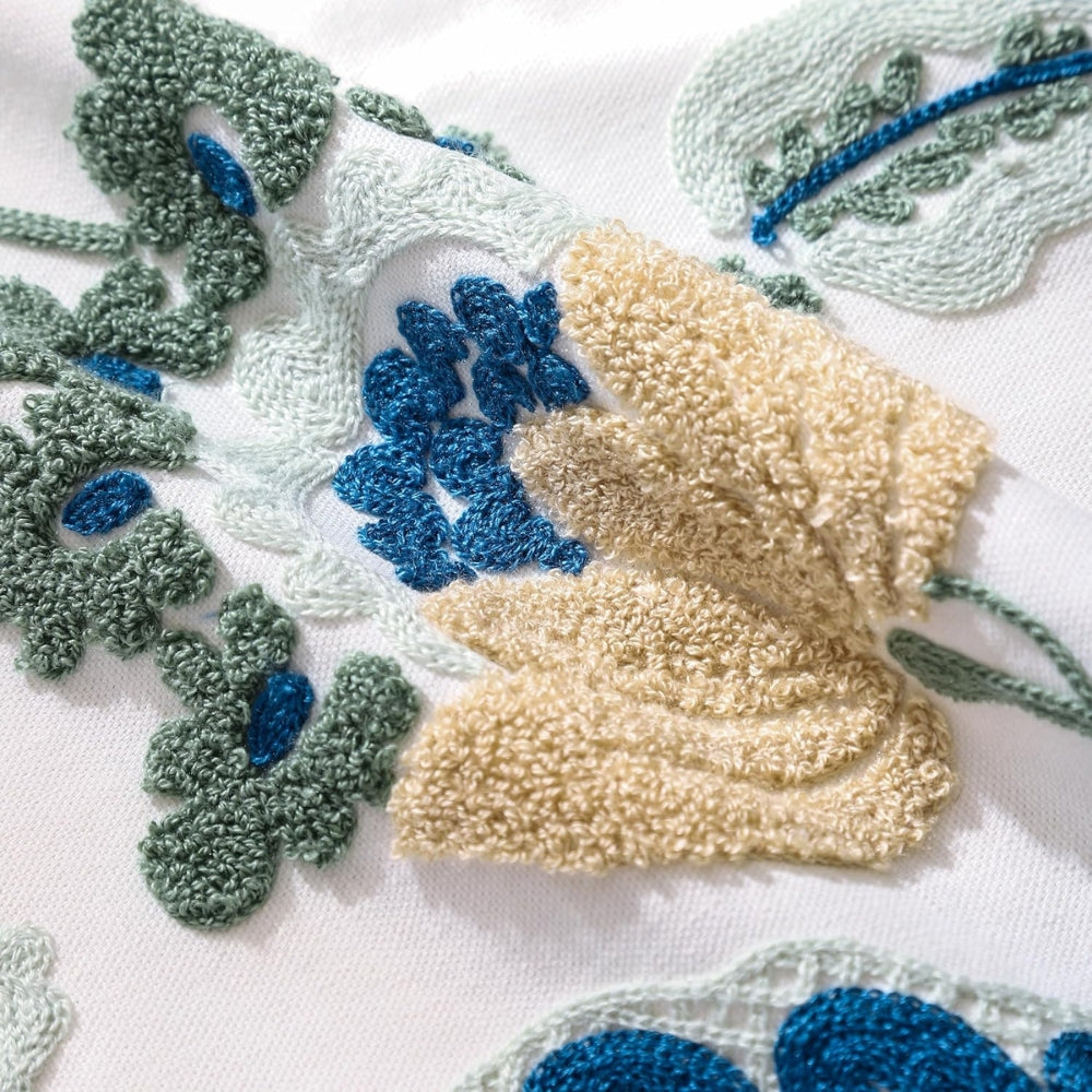 Housse de coussin touffetée fleurie Denza