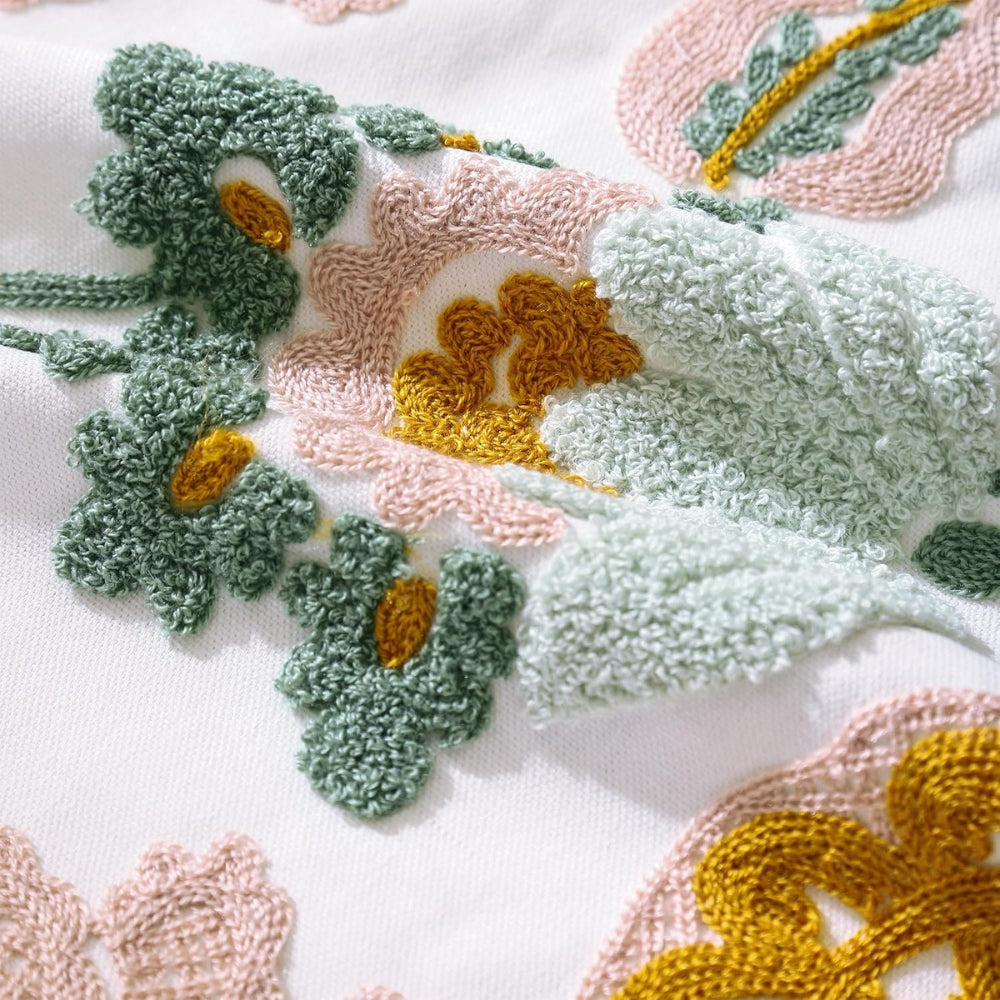 Housse de coussin touffetée fleurie Denza