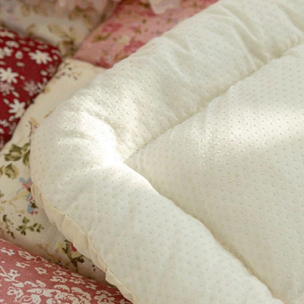 Housse de canapé matelassée fleurie