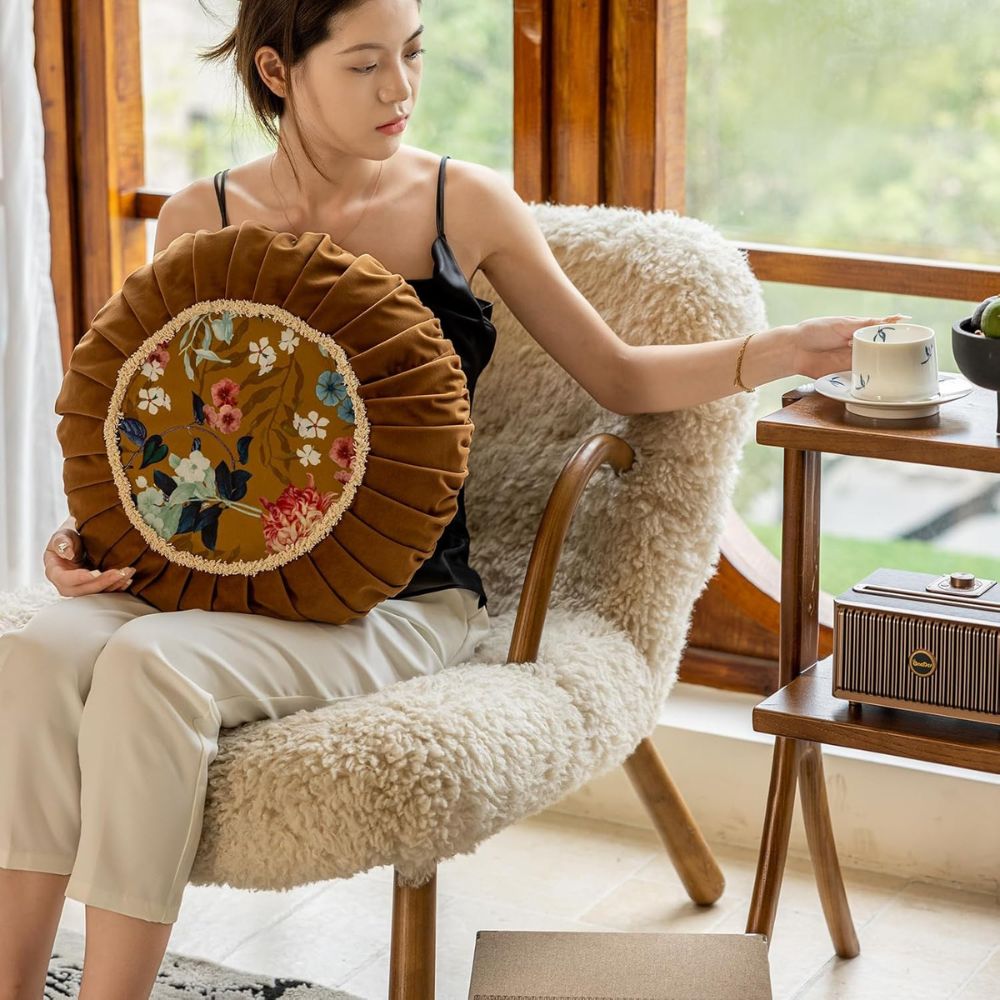 Coussin rond en velours bouquet fleuri