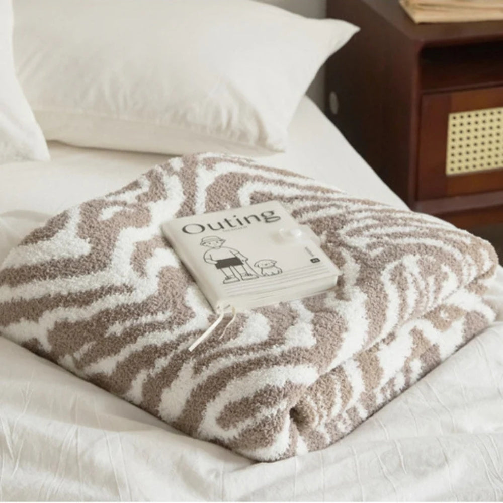 Plaid tricoté motif zèbre