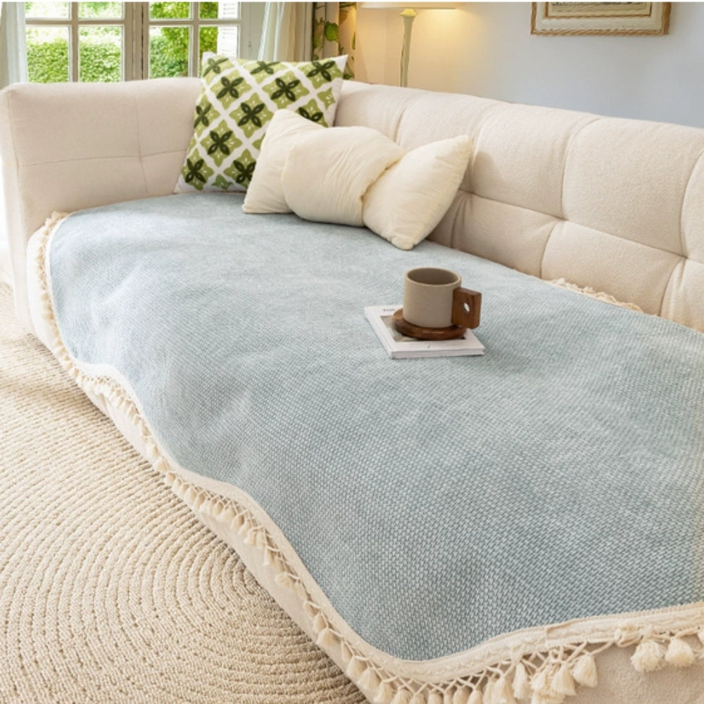 Housse de canapé en chenille texturée à pompons