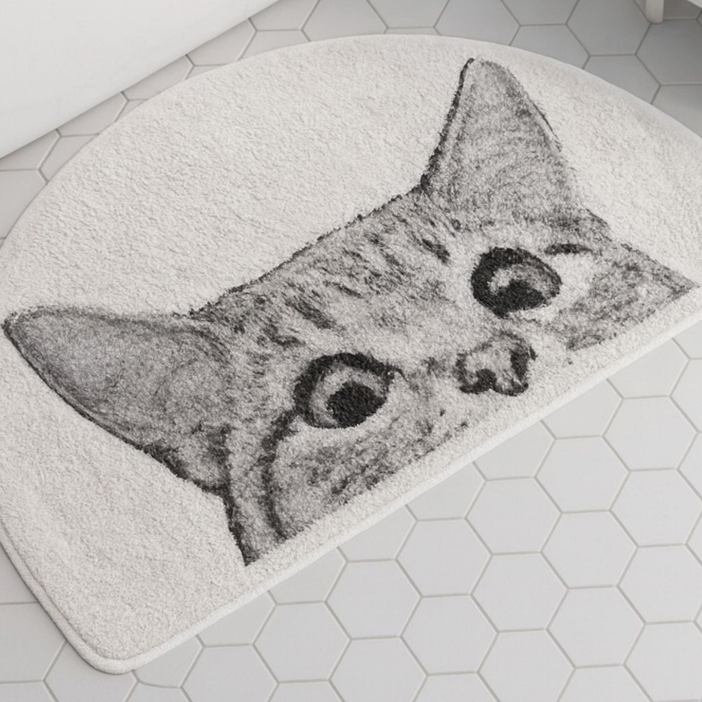 Tapis de bain chat curieux
