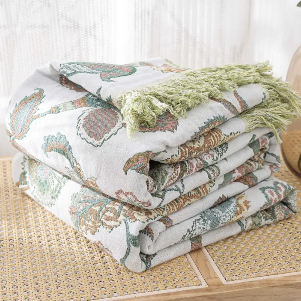 Plaid en coton fleuri à pompons Reverie