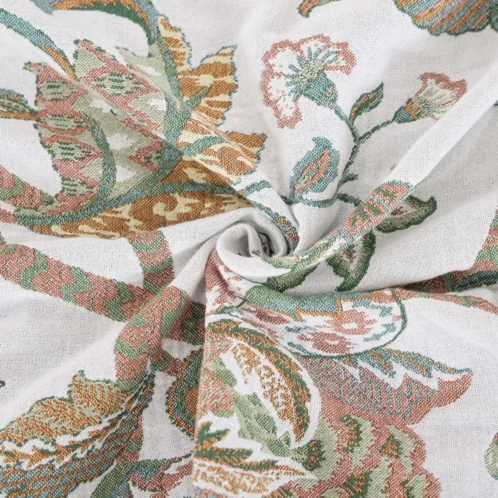 Plaid en coton fleuri à pompons Reverie