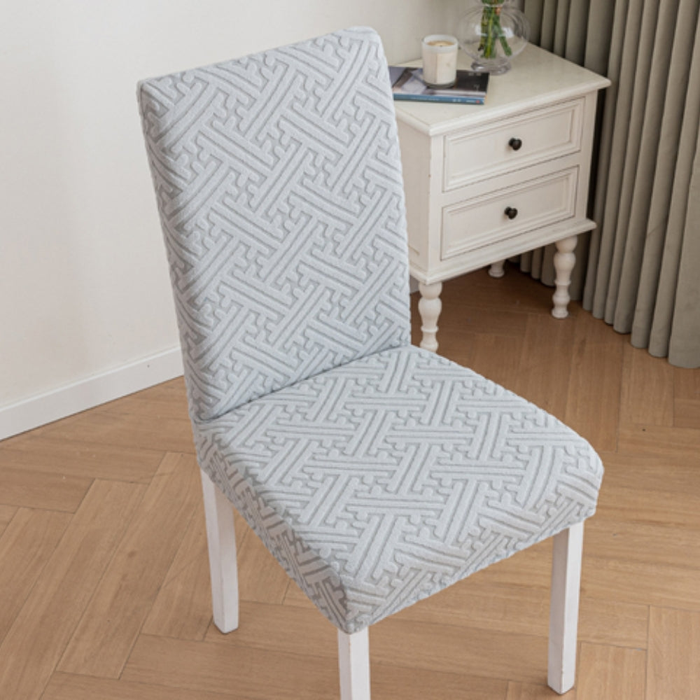 Housse de chaise extensible Silvra à losanges