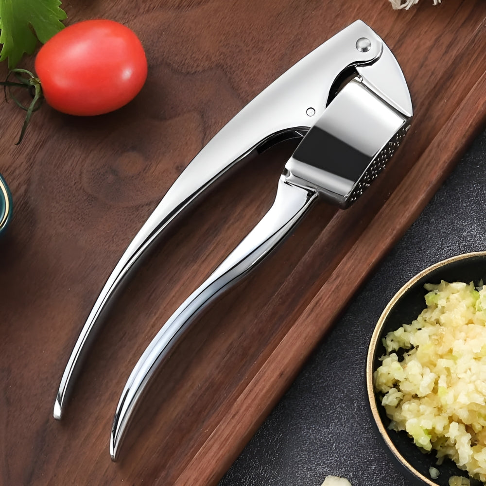 Presse-ail minimaliste en inox à poignée antidérapante