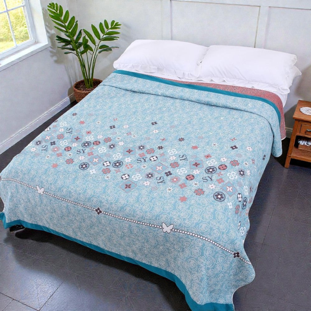 Plaid en gaze de coton fleuri turquoise