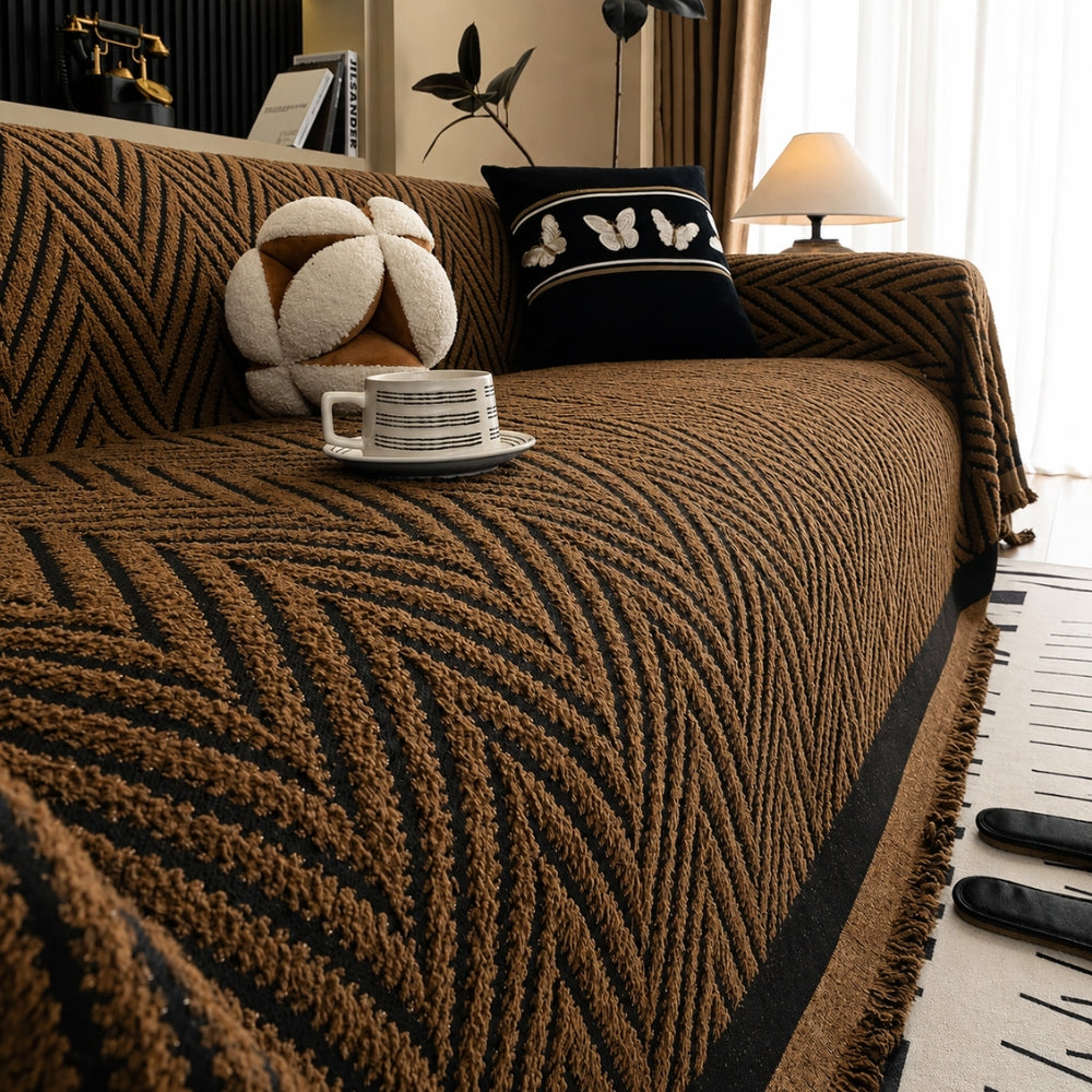 Housse de canapé à chevrons et pompons